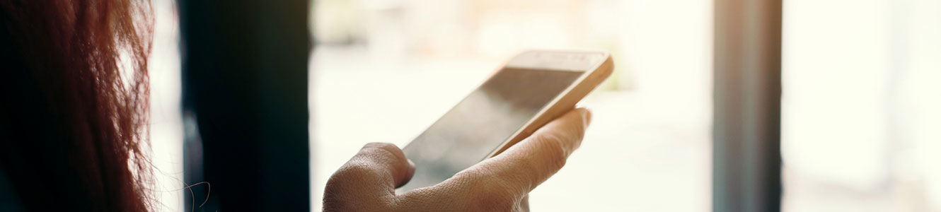 Lady looking at a smartphone