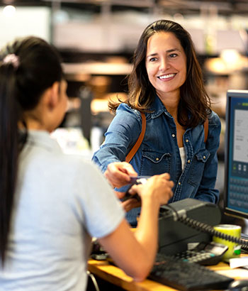 A lady checking out in a store