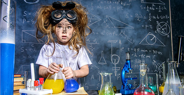 Young girl working on a rocket science project