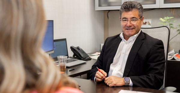 Jeff looking at a customer in his office