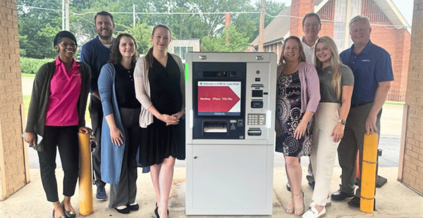 Group of CNB St. Louis Bank team members standing around our new ITM at our Maplewood location.