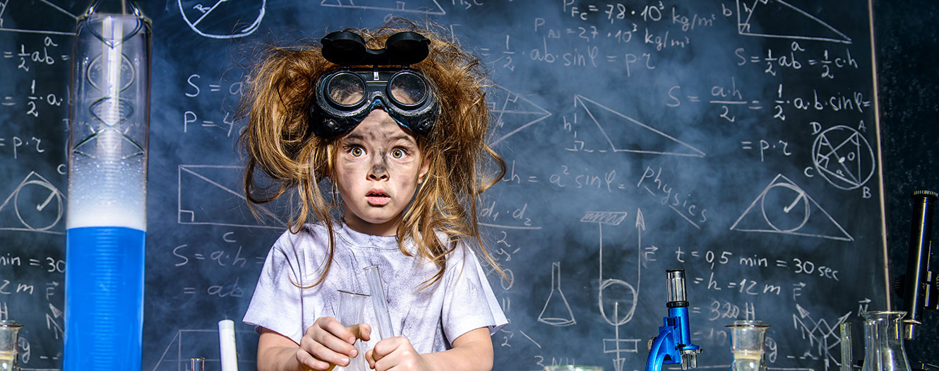 Young girl working on a rocket science project